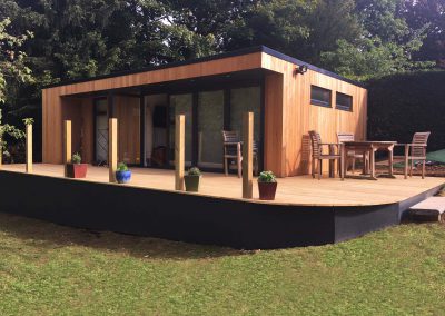 Living annexe with cedar cladding and large wrap-around deck