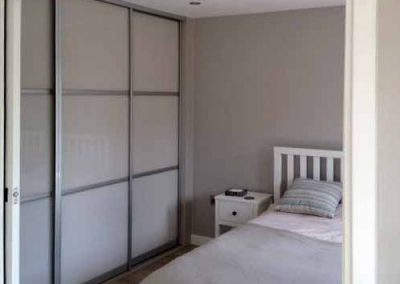 Interior of bedroom with pocket doors in living annexe