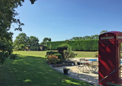 large garden with garden room